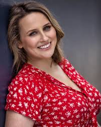 Let's introduce our cast! Lizzie Moore. As Vice-President Sam Sheedy, she's  got the critical job of keeping the President in check, along with  organising all the Exec meetings. And we all know