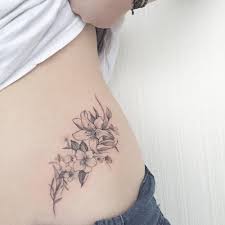 Cute small heart tattoos on wrist. Fine Line Style Violet And Lily Tattoo On The Left Side