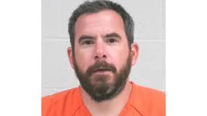 Advance man accused of shooting tires