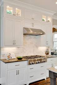 White Shaker Cabinets Pair With Marble Kitchen Backsplash Shaker Style Kitchen Cabinets Kitchen Cabinet Styles White Shaker Kitchen