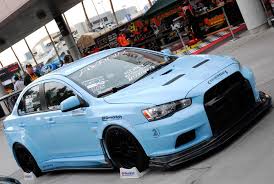 Subaru Impreza Wrx Sti Vs Mitsubishi Lancer Evolution X Team Hybrid S Custom Mitsubishi Lancer Evolution X Features Performance Air Filter At Sema Mitsubishi Lancer Evolution Mitsubishi Lancer Mitsubishi Evo