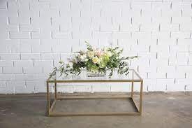 The modern coffee table has many roles. Gold Glass Coffee Table Pretty Willow Prop Hire Perth