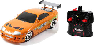 The iconic 1994 toyota supra that paul walker drove in the film crossed the auction block at. Jada Toys 253206006 Fast Furious Rc Auto Brian S Toyota Supra Orange Ferngesteuertes Auto Turbofunktion 2 Kanal Funkfernbedienung Usb Ladefunktion Inkl Batterien 1 16 Orange Amazon De Spielzeug