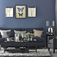 Powdery blue walls, bold florals, and glamorous geometrics help the overscale living room feel more intimate. Denim Blue And Grey Living Room Lounge Ideas Living Room Grey Navy Living Rooms Room Decor