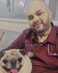 The best place a Beagle can be. In bed with dad and his big sister.