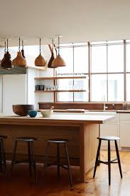 Collected Wood Pendants Over A Wood Island In The Kitchen Modern Shaker Beach House Tour On Coco Kell Kitchen Interior Interior Design Kitchen House Interior