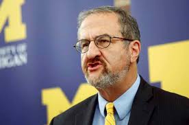 University of Michigan fires president over 'inappropriate relationship'  with subordinate