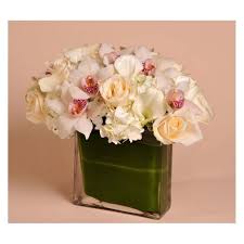 The Plaza Luxury At Its Finest Enjoy Your Stay At The Plaza With A Classic White Arrangement Of Roses Hydrangea Flowers Floral Industry Flower Arrangements