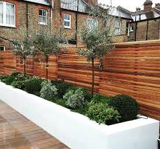 Transform the look of your bedroom by updating possibly the most important furniture in the space, letting you create a grand feel or a serene retreat. Raised Flower Beds And Ever Greens Is And Ren Studios Ltd Homify Small Garden Fence Outdoor Gardens Design Backyard Landscaping Designs