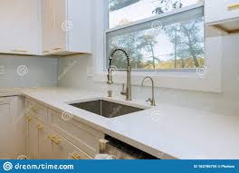 stainless steel kitchen sink and window