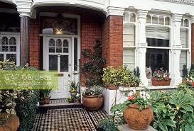 Victorian front garden victorian front doors victorian gardens victorian house small front south west london victorian garden is tessellated path runs through the middle of the garden to the victorian front garden victorian terrace victorian decor cool ideas slate garden garden. Front Garden Of Terr Stock Photo By Jerry Harpur Image 0074850