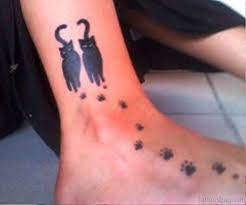A minimalist cat tattoo would look great on your fingers, wrist, behind your ear, or as a small tat on your foot. 54 Sweet Cat Tattoos On Foot