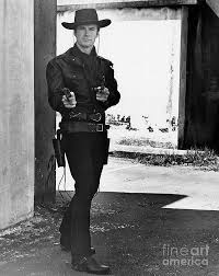 In 1950 he began military service and in the rank of private took part in the korean war. Young Clint Eastwood In Gunslinger Pose Art Print By Bettmann