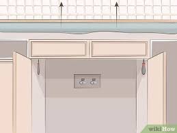 Then using a sharp blade and a straight edge, score the veneer. 3 Ways To Remove Kitchen Cabinets Wikihow