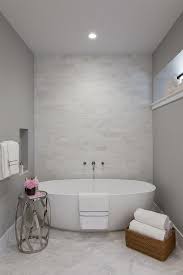 Here are the 5 keys to get it right. Egg Shaped Tub In Front Of White Marble Tiled Accent Wall Contemporary Bathroom