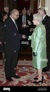 Queen Elizabeth II meets Keith Vaz, the Labour MP for Leicester East,  during a reception for backbench MPs at Buckingham Palace, London Stock  Photo