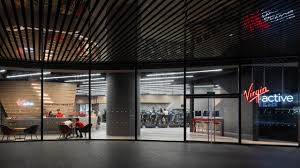 Virgin active offre palestra, corsi fitness, piscina, area relax, centro benessere, personal trainer, area bimbi. Virgin Active Marina One Projects Orbit Design Studio