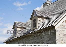 Cedar shingles, whether being shake or regular thickness, new or old, same painting recommendations fits all types, across the board. View Of The Cedar Shingles Roof And Dormer Windows On An Old Canadiana 1722 Cottage Style Fieldstone Residential Home Quebec Canada Stock Photograph 1935366 Fotosearch