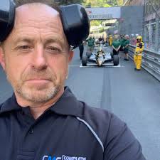 What is the purpose of the dents or stake marks in the combustion chambers  of a 1970s BMW 2002ti 2.0 liter circuit racer cylinder head?