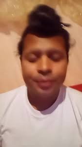 Person in White Shirt Against Textured Wall Setting