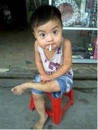 pin on a little boy eating cigarette this is so funny picture