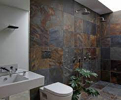 A bathroom window is a nice feature. Slate Tiles Give This Cambridge Bathroom A Rustic Connection To Nature In 2021 Slate Bathroom Slate Tile Slate Shower