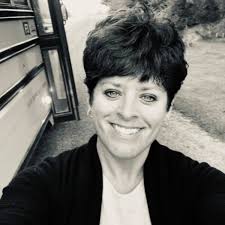 Who owns the yellow farmhouse