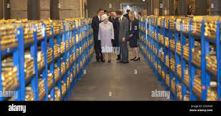 Queen Elizabeth II tours the gold vault during her visit to the Bank of  England in central London Stock Photo - Alamy
