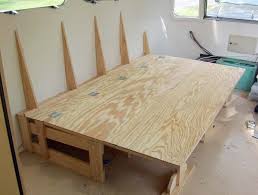 The bench seat problem those of you who love getting away from it all but also have kids are probably all too familiar with the question of how to have family vacations in a small diy camper van. Couch Bed And Entertainment Center Progress Airstream Forums Campervan Bed Airstream Couch Bed