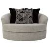 The unique shape and tufted design create a cozy, inviting look, making it easy to add this white swivel chair to just about any room. 1