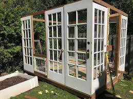 So i got the idea of building her a new greenhouse out of the old single paned windows off the house. How To Build A Greenhouse From Reclaimed Doors And Windows