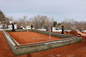 It consists of a reinforced concrete beam that transmits the load from a bearing wall into spaced foundations such as pile caps or caissons. What Is A Grade Beam Foundation Learn Natural Building