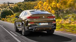 Photo Comparison Bmw X6 M50i Vs Mercedes Amg Gle 53 Coupe Bmw X6 Mercedes Amg Good Looking Cars