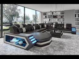 Buying Modern Furniture In Las Vegas Eileend Leather Sectional Sofa Features An Adjustable Headre Leather Sectional Sofa Leather Sectional Futuristic Furniture