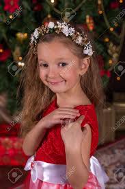 Shoppe unsere kleider auswahl online mit kostenloser lieferung & retoure! Little Beautiful Girl In Red Dress At The Christmas Tree Portrait Stock Photo Picture And Royalty Free Image Image 67418939