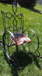 diy metal rocking chair made from a tractor seat antique wheels horseshoes ornate scrolls and springs welding art projects metal yard art welding art
