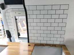 If you use real, ceramic tile, that would be thicker. Backsplash With Tictactiles In Diy Camper Kitchen Overlandys