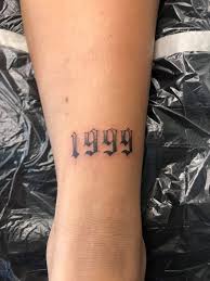 This tattoo is done by drawing roman numbers on the fingers. Bel Air Tattoo 1999 1999 Oldenglish Numbers Year Facebook