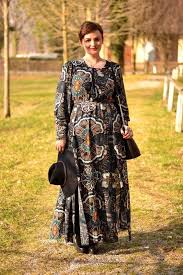 Short Haired Smiling Woman In Black Maxi Dress With Long Sleeves And Multicolored Floral Embroidery Bohemian In 2020 Boho Fashion Plus Size Fashion Boho Style Outfits
