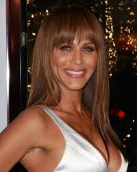 Nicole Ari Parker's sleek long hair with angled sides and zigzag bangs