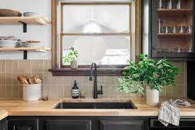 Two tone gray and white kitchen cabinets with black countertop. Wood And Butcher Block Kitchen Countertops Hgtv