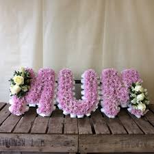 To best serve families, we are conveniently located near several cemeteries and closely affiliated with greenlawn memorial park, highland park cemetery and lindenwood cemetery. Funeral Flowers Peter Graves Florist Mum Floral Letters Pink Mum Tribute