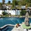 Learn how to enhance your pool with landscaping features such as planters, waterfalls, shade structures and more. 1