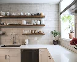 Brown Wooden Shelves On White Subway Tiles Kitchen Backsplash Over White Quartz Countertops And Kitchen Shelf Design Floating Shelves Kitchen Floating Shelves