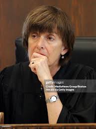 Judge Margaret Hinkle listens to a victim impact statement after John...  News Photo