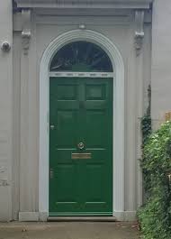 Dark stained wooden door with sidelights. Sherwin Williams Front Door Paint Colors And The Important Secret For Choosing One The Decorologist