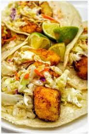 Combine the fish with the lime zest and juice, pimenton, garlic, oil and salt, to taste, in a medium bowl. Fried Fish Tacos With Tangy Slaw Sweet Potato Fries Life Time Vibes Recipe Fried Fish Tacos Sweet Potato Fries Fried Fish