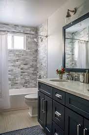 Remodeled master bathroom with rain showerhead and standalone inspiration for a large transitional master gray tile and ceramic tile porcelain floor and gray floor. Most Popular Small Bathroom Remodel Ideas On A Budget In 2018 This Beautiful Look Was Created Bathroom Remodel Master Small Bathroom Remodel Bathrooms Remodel