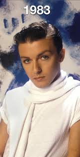 Ricky Gervais AS A POP singer in the 1980s.
