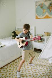 We did not find results for: Little Boy Playing A Guitar In His Bedroom Stock Photo Offset